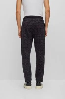 Cotton tracksuit bottoms with drawstring waist and monogram jacquard