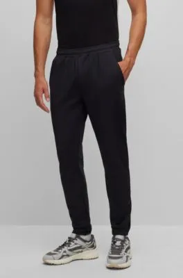 Cuffed tracksuit bottoms in active-stretch fabric