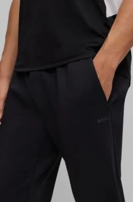 Cuffed tracksuit bottoms in active-stretch fabric