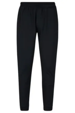 Cuffed tracksuit bottoms in active-stretch fabric