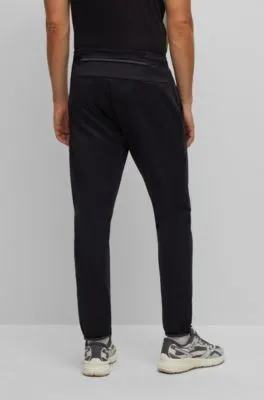 Cuffed tracksuit bottoms in active-stretch fabric