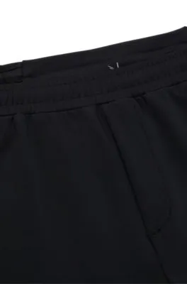 Cuffed tracksuit bottoms in active-stretch fabric