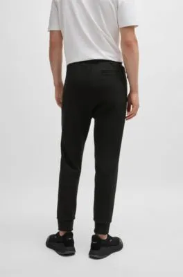 Tracksuit bottoms with tape inserts