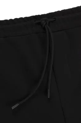 Tracksuit bottoms with tape inserts