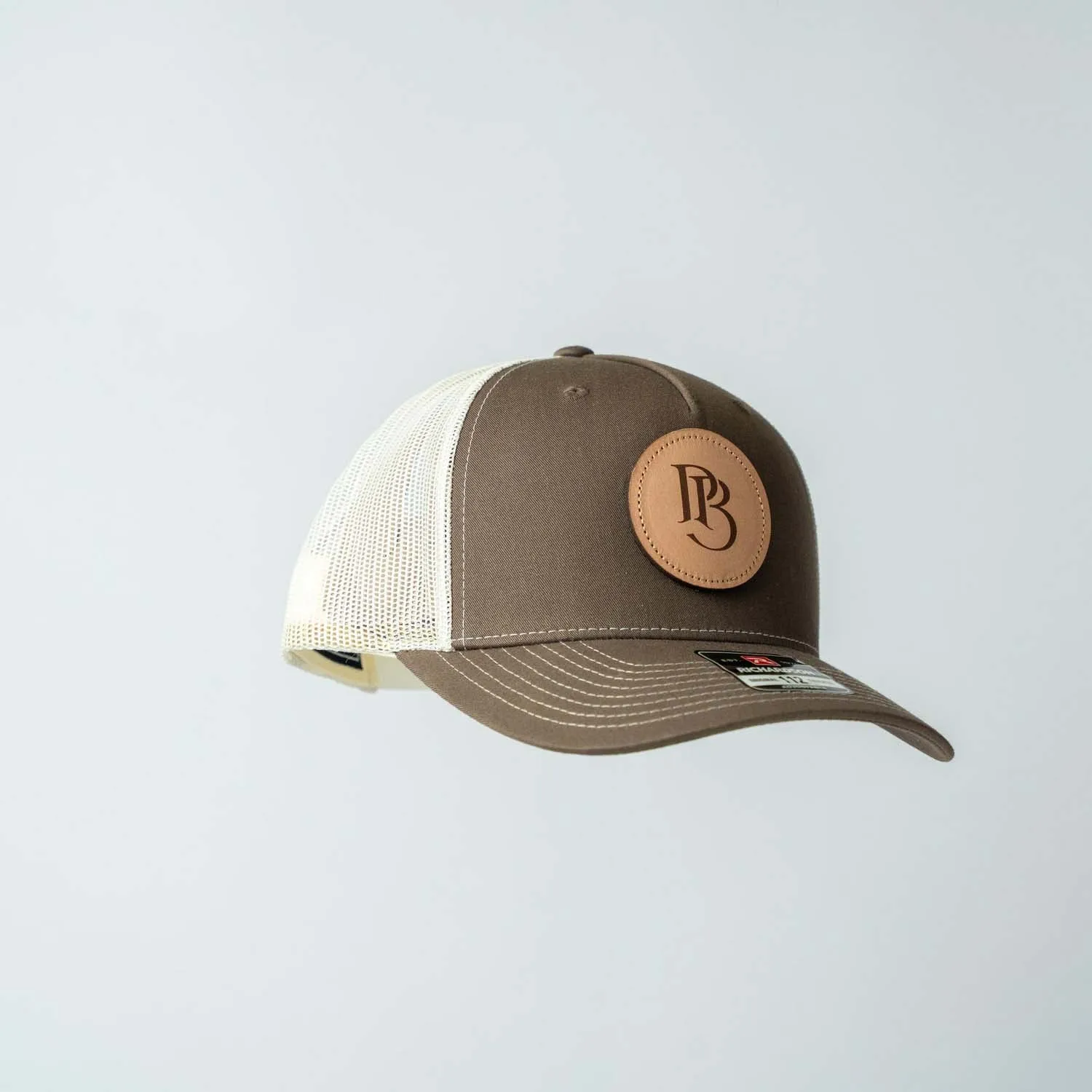 Trucker Hat | Chocolate Chip & Burch | Circular Monogram Logo Patch