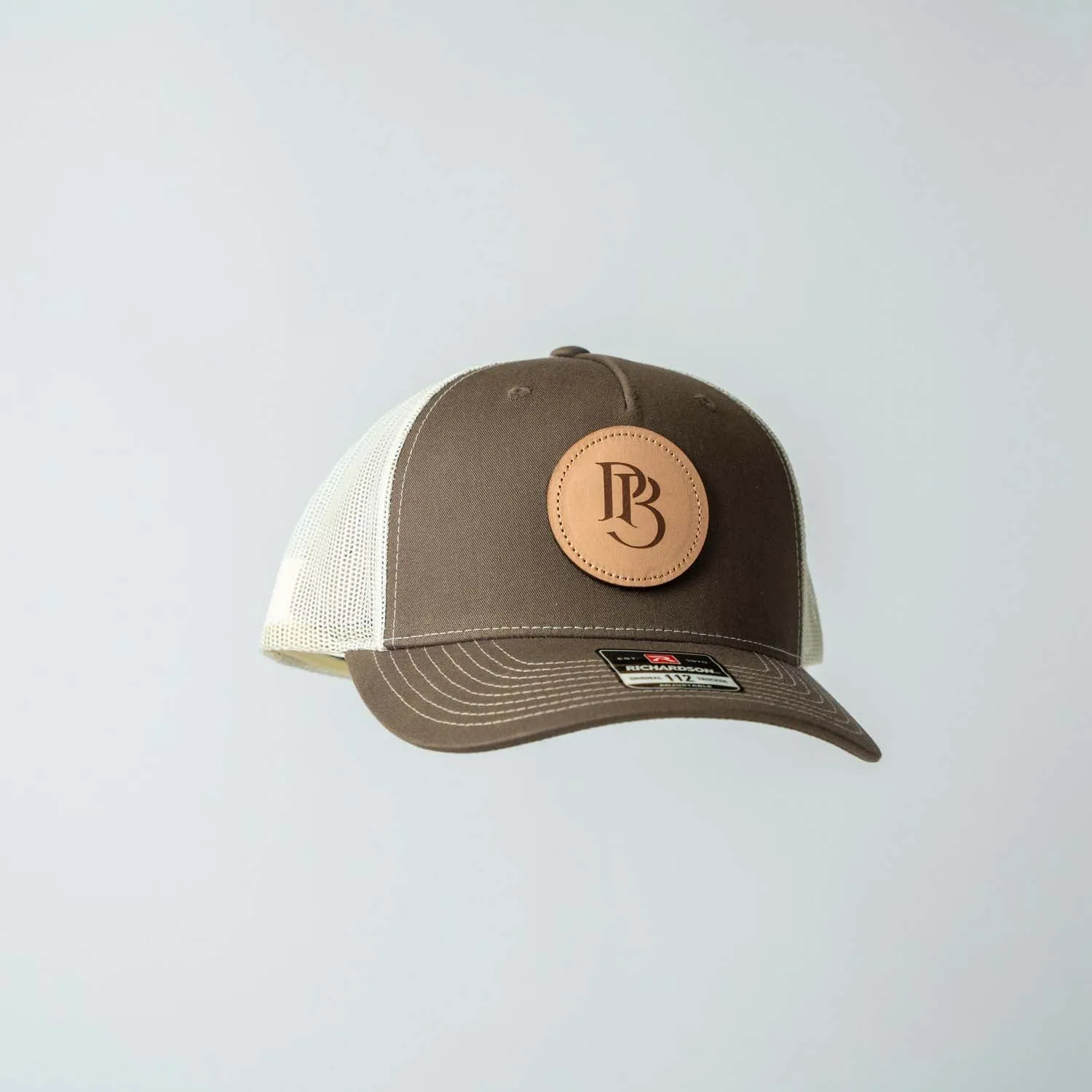 Trucker Hat | Chocolate Chip & Burch | Circular Monogram Logo Patch